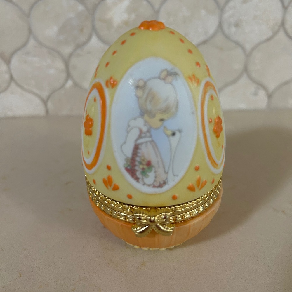 Precious Moments 1996 retired collectible hinged box egg with girl and goose.